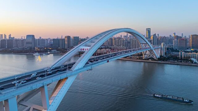 4K Time Lapse Aerial view of Xuhui Riverside and Lupu bridge in Shanghai at sunset, China