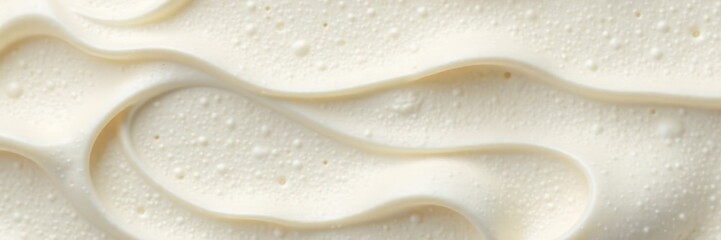Smooth creamy white ice cream with small air pockets , vanilla ice cream texture, fluffy