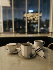 Coffee and bread on the table in the evening