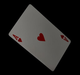 Flying playing card for poker and gambling, ace heart isolated on black, clipping path
