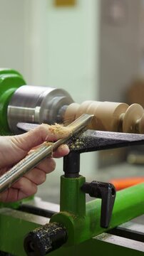 Girl Turning a Wooden Blank on a Lathe Machine