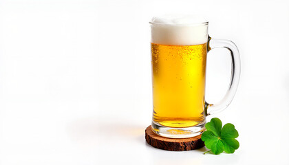 Glass of beer with foam on wooden coaster and clover leaf, St. Patrick's Day theme