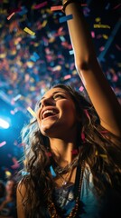 Fototapeta premium a woman is smiling while holding up confetti