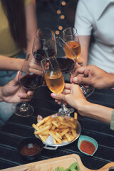 Cheers to Connection: A close-up of friends raising their glasses in a toast, celebrating life's simple pleasures with a shared meal and laughter.  