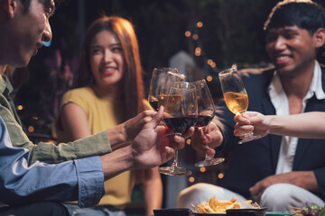 Cheers to Connection: A group of diverse friends raise their glasses in a toast, capturing the warmth and joy of shared moments and connections. 