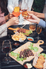 Cheers to Success: A celebratory toast with friends, enjoying delicious food and drinks at an upscale restaurant.  The image captures a moment of joy, friendship, and good times. 