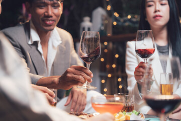 Stylish Friends Enjoying Wine at a Restaurant 
