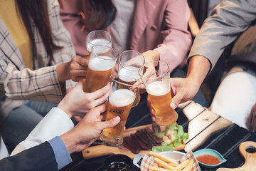 Cheers to Friendship: A toast to camaraderie and good times, captured in a close-up shot of friends raising their beer glasses in a heartwarming celebration.  