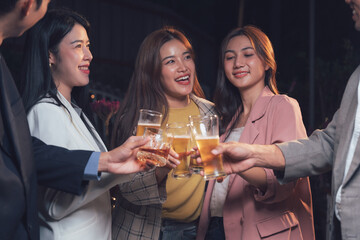 Nightlife Cheers: Friends Celebrate Success with Sparkling Toast 