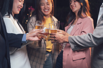 Cheers to Success: A group of four diverse professionals raises their glasses in a celebratory toast. Their smiles and laughter capture the warmth and camaraderie of a successful event.  