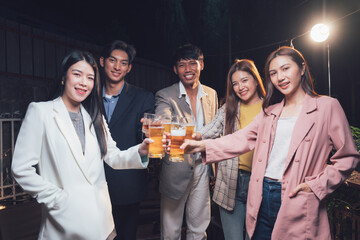 Night Out Cheers: A group of friends raise their glasses in a toast, their laughter and camaraderie illuminating the night.  The joy of connection is palpable in this image.