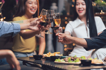 Cheers to Good Times: A group of friends raise their glasses in a toast, capturing the joy and camaraderie of a night out.