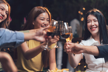 Cheers to Good Times: A group of friends raise their glasses in a warm and celebratory toast, their smiles radiating happiness and connection.