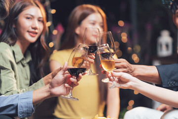 Cheers to Togetherness: A close-up shot capturing the joy and intimacy of friends raising their wine glasses in a toast, their smiles radiating warmth and connection.  