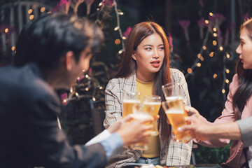 Nightlife Cheers: Friends toasting beers at an outdoor patio, enjoying a lively evening.  Warm lighting and casual atmosphere.