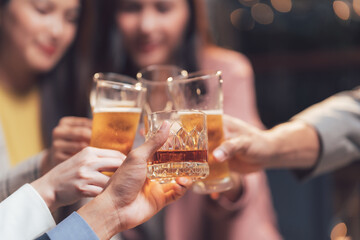 Cheers to Success: Close-up of hands clinking glasses, celebrating a shared achievement. Capturing the warmth and camaraderie of a team's shared success.  
