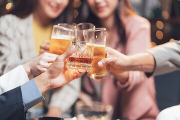 Cheers to Success: Friends raise a toast, celebrating a shared moment of joy and camaraderie in a warm, inviting setting.  The image captures the essence of friendship and good times. 