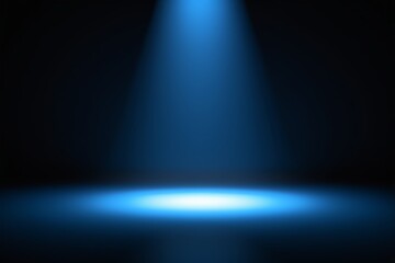a blue spotlight shines brightly on a black background