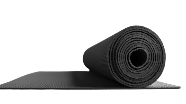 Black yoga mat rolled out elegantly in a serene home setting inviting mindfulness and peace