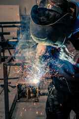 Welder, craftsman, assembly of iron, steel and other metals. Industrial steel welding technician in factory, construction professionals.