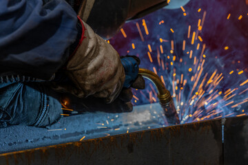 Welder, craftsman, assembly of iron, steel and other metals. Industrial steel welding technician in factory, construction professionals.