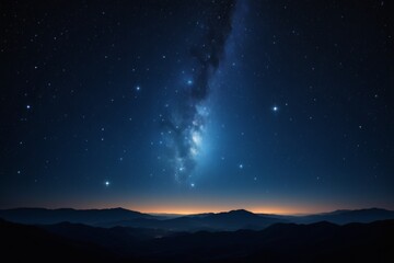 Fototapeta premium starry night sky with a bright milky and a distant mountain range