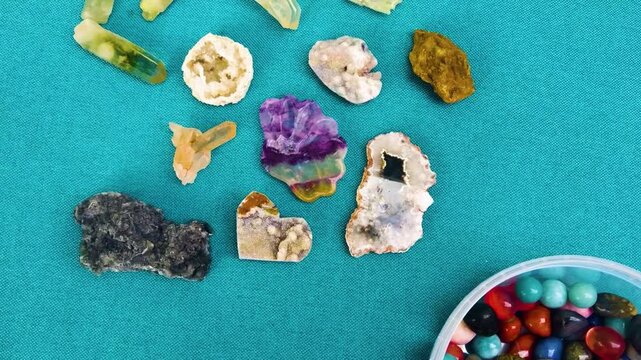 colorful various uncut and raw mineral stones, gemstone and healing stone collection, Healing reiki chakra crystals over fabric background. Gemstones for wellbeing, harmony, meditation, relaxation