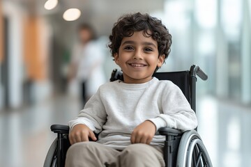 Smiling young asian boy in wheelchair at school corridor