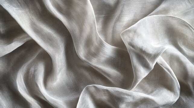 creative image of crinkled metallic fabric texture in bold silver tones set against neutral background with ample copy