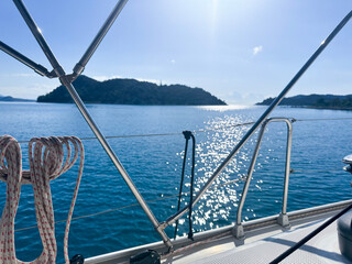 Sailing adventure on a sunny day with stunning sea views in a tranquil bay