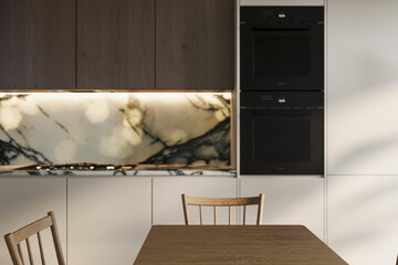 Modern kitchen detail featuring a sleek marble backsplash, black built-in ovens, and a wooden dining chair. A minimalist and elegant space ideal for interior inspiration.
