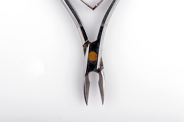 manicure accessories on a white background. manicure file. cuticle nippers