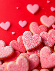 red background with a bunch of heart shaped cookies, red hearts, on a red background, cookies, pink hearts in the background, beautiful high resolution, pink and red colors, close.
