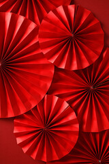 Chinese New Year 2025 concept. Abstract paper fans on red background