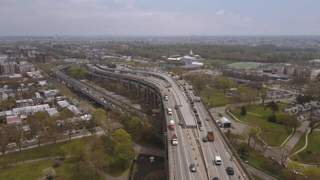 NEW YORK, USA - JANUARY 5, 2025: Aerial view of busy highways and cityscape showing traffic flow and urban landscape
