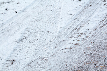 Tire tracks in the snow in the winter