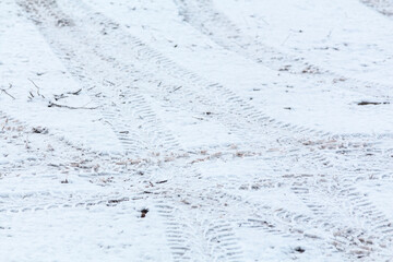 Tire tracks in the snow in the winter