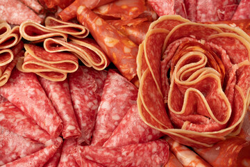 Different kinds of meat cuts on a board.