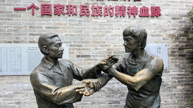 Canton, China - 20th October 2024: Bruce Lee Ancestral Home. Sculpture of Bruce Lee practicing kung-fu with his father.