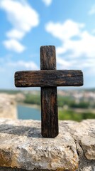 Naklejka premium A wooden cross sitting on top of a stone wall