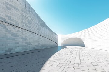 Fototapeta premium Modern art curved building with empty brick square against clear sky background.