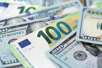 Big pile of Euro and USD banknotes. Many european and united states dollars