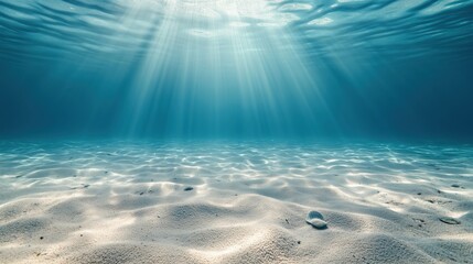 Serene underwater seascape: soft sandy ocean floor extending to a hazy distant horizon