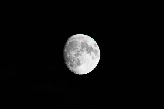 Waxing gibbous moon on a black background.