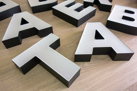 Three-dimensional acrylic letters for signage.Production of outdoor advertising for the store. Make letters for the logo.