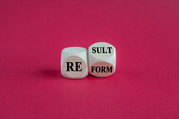 Concept words Reform Result on beautiful wooden cubes. Beautiful pink background. Business Reform and result concept.