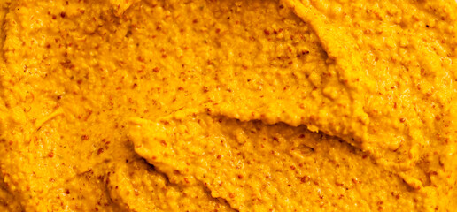 Smoothie of fresh fruits and berries, orange, banana, mango, sea buckthorn, cloudberry. Ice cream texture. Fruit yogurt ice cream. Delicious sweet dessert close-up as a background.