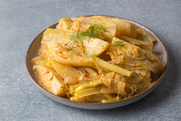 Organic Baked Fennel Bulbs with Salt and Pepper. Fennel dish with olive oil.