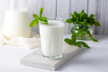 Glass cup of Turkish traditional drink ayran , kefir or buttermilk made from yogurt, healthy food