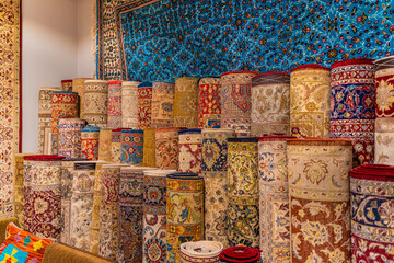 Traditional Turkish carpets are offered for sale at a bazaar